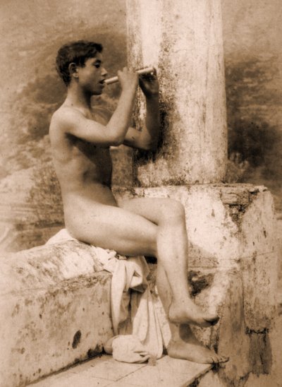 Study of a boy playing a flute by Baron Wilhelm von Gloeden